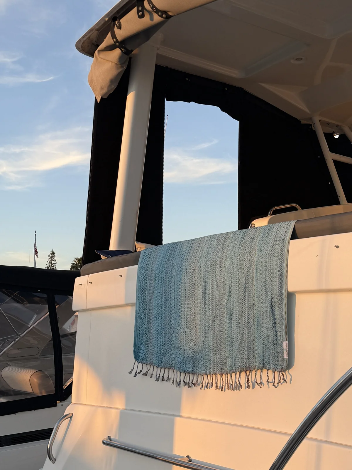 Blue Salt Rag draped over a boat seat in warm coastal light.