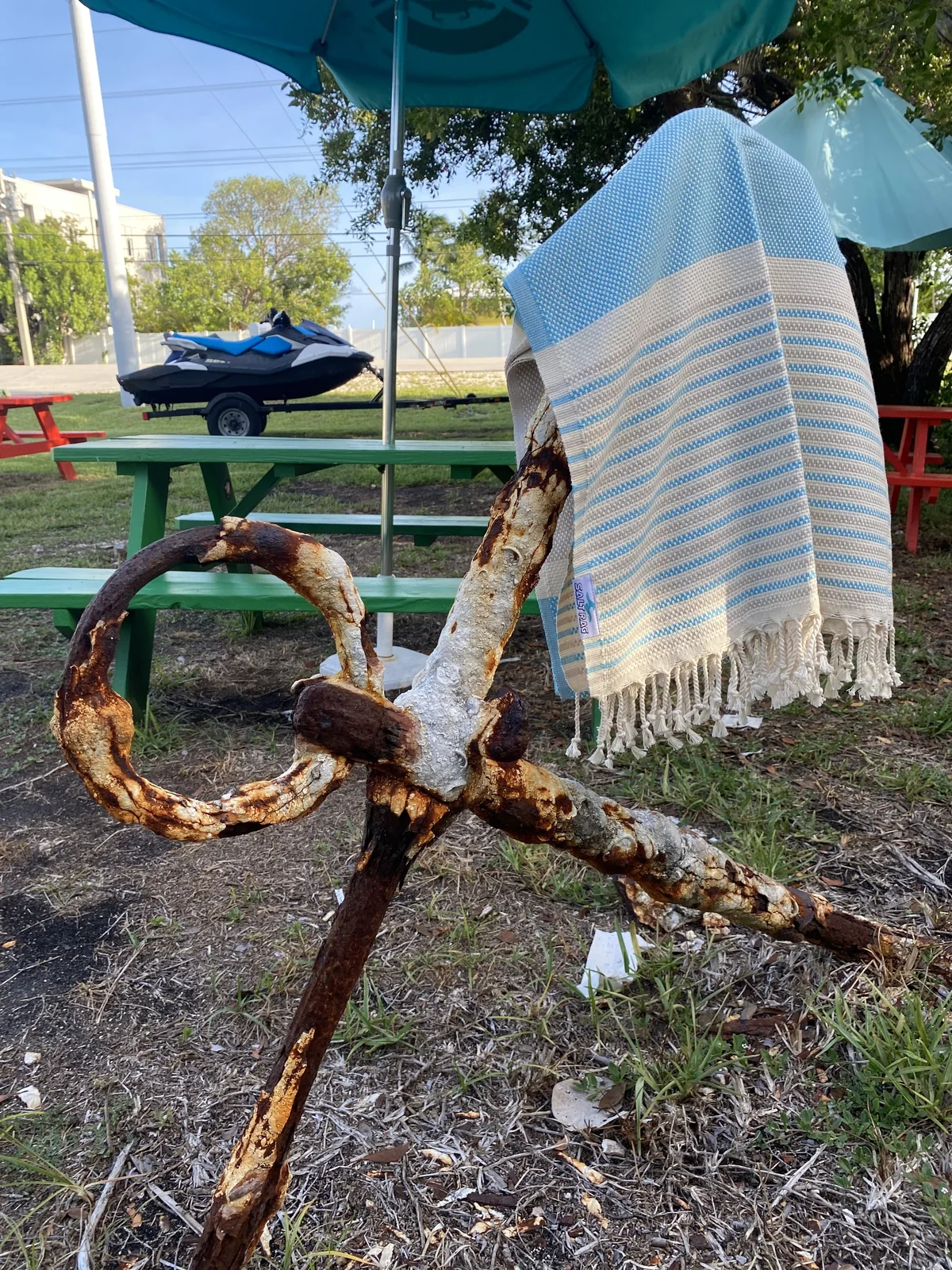 White-and-blue Salt Rag draped over a wooden anchor.